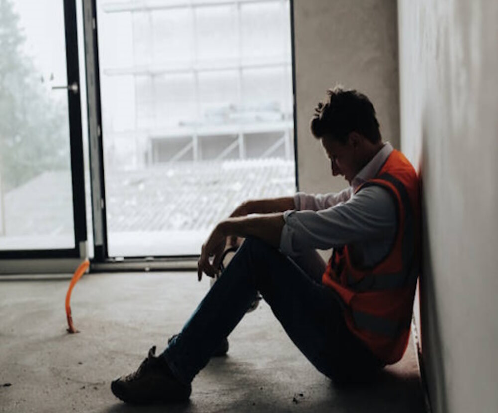 Construction worker taking a quiet moment away from the active site
